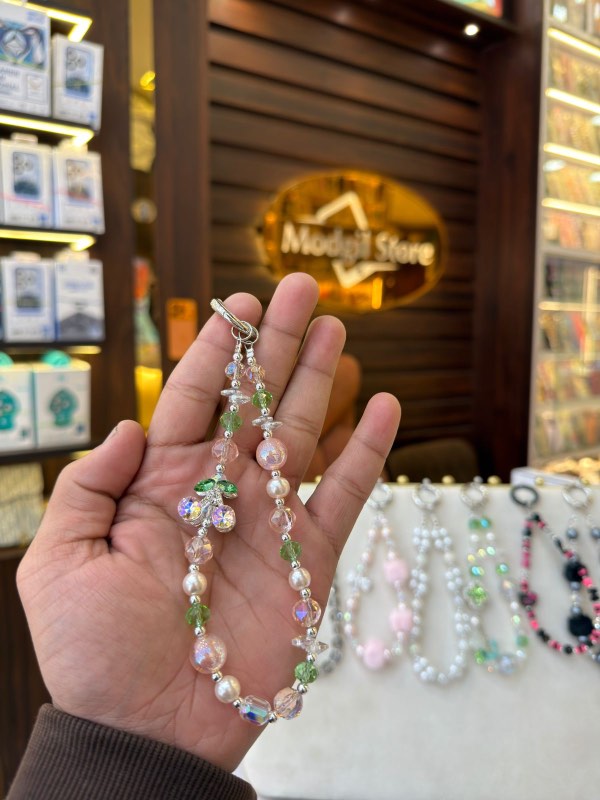 Green stone with pearl charm